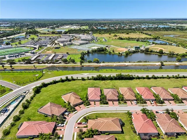 Aerial perspective of suburban area with a nearby body of water
