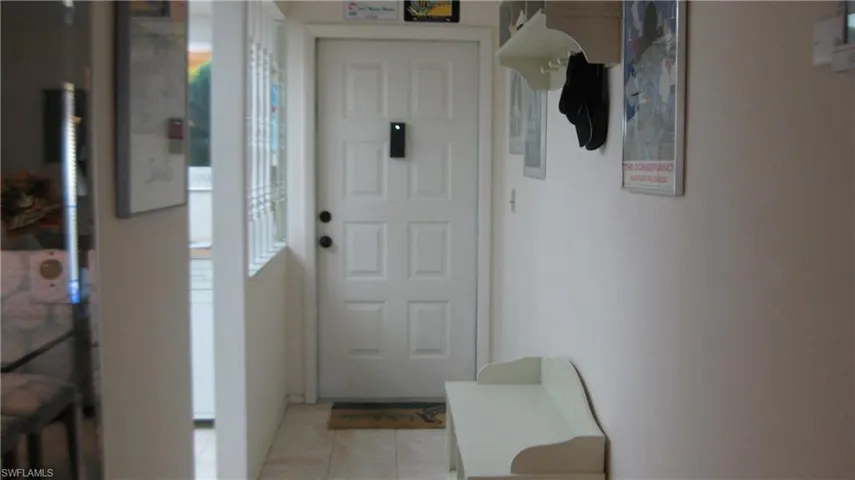 Doorway to outside with light tile patterned floors