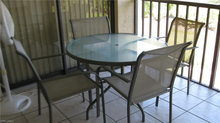 View of screened lanai. Sliders to primary bedroom.