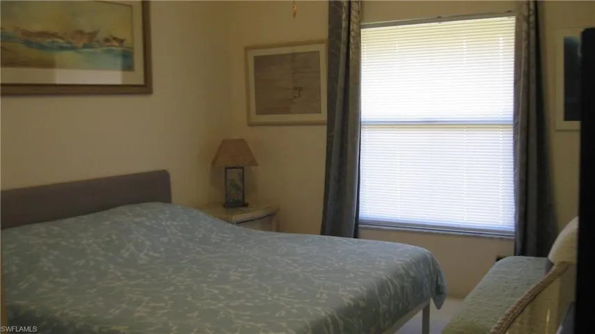 View of primary bedroom with window allowing for natural light.