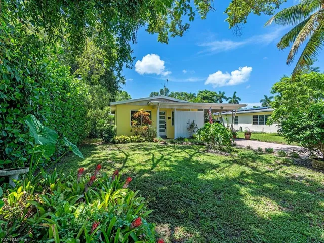View of front of property with a front lawn
