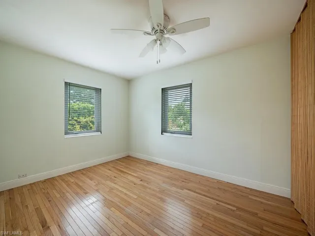 Spare room with light hardwood / wood-style flooring and ceiling fan