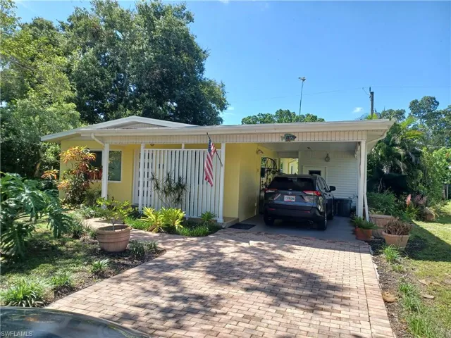 View of front of house featuring a carport