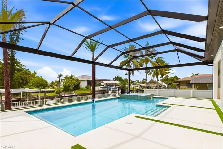 Enjoy a resort-style heated pool and elevated spa overlooking the Colony canal