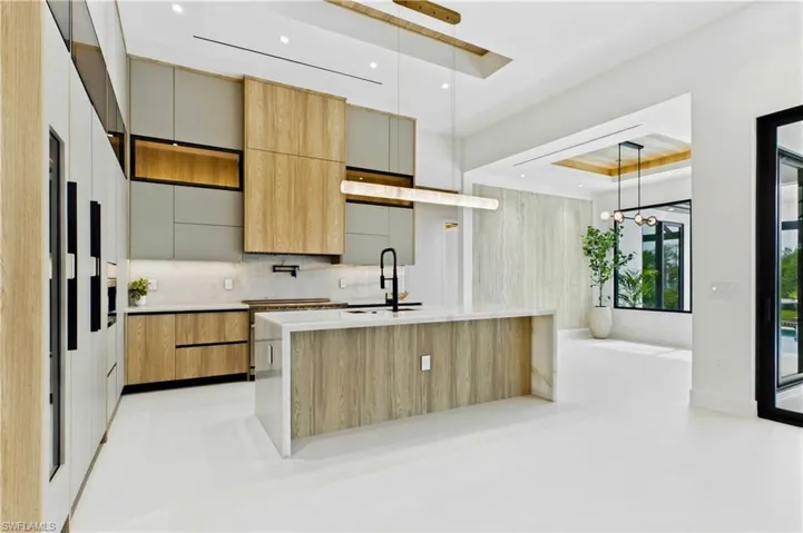 Top-of-the-line CABINETRY extending to the ceiling w/ under- & upper-cabinet lighting
