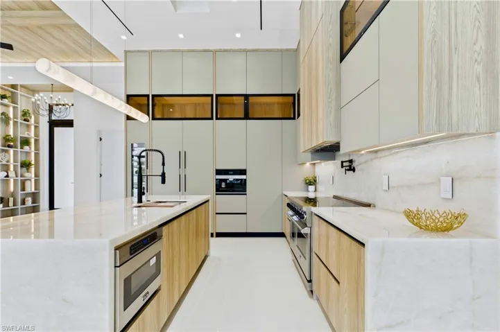 Liebherr built-in DUAL-ZONE WINE COOLER, Viking FLAT RANGE w/ DOUBLE CONVECTION OVENS, INTEGRATED DISHWASHER, custom built-in Liebherr SIDE-BY-SIDE REFRIGERATOR/FREEZER & Miele INTEGRATED COFFEE MACHINE