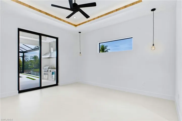 Spacious Primary Bedroom with private sliding doors to the screened lanai