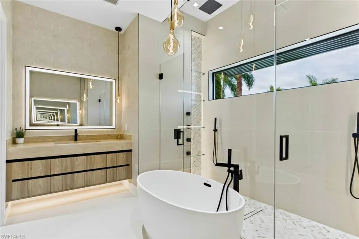 All bathrooms feature SEAMLESS TRAVERTINE INTEGRATED SINKS w/ SOFT VEINING