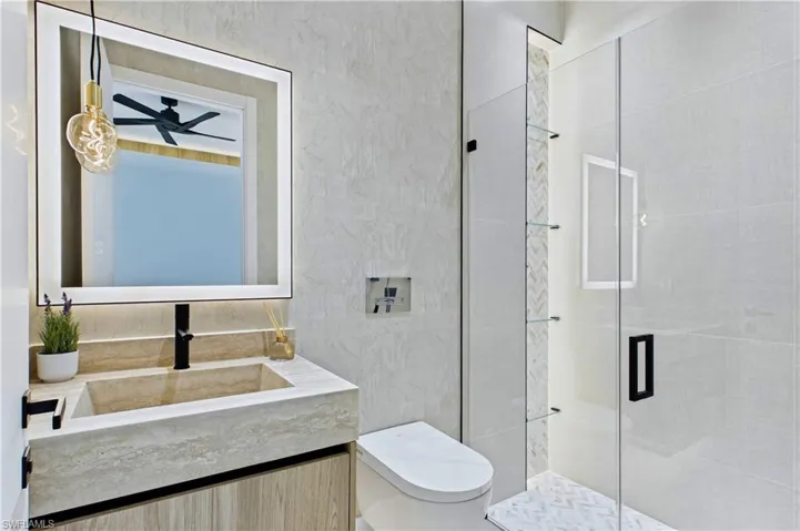 Second Primary Bathroom with independent sliding doors to the patio/pool area