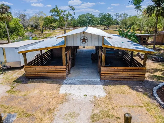 View of outdoor structure with an exterior structure and view of scattered trees