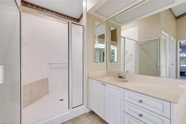 Notice the built in bench in this spacious shower.