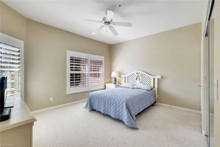 Guest bedroom with plenty of space, a large closet and a ton of natural light.
