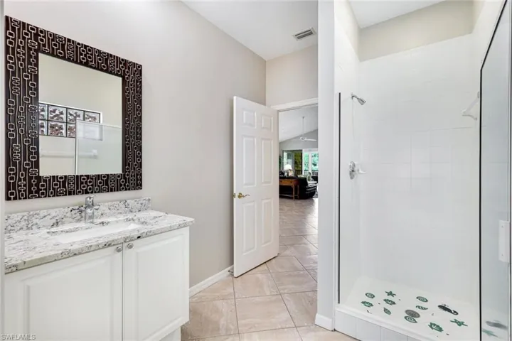 Well-appointed guest bath with clean finishes and a walk-in shower.