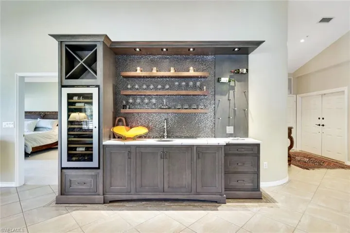 Custom bar area with wine storage, ideal for entertaining guests in style.