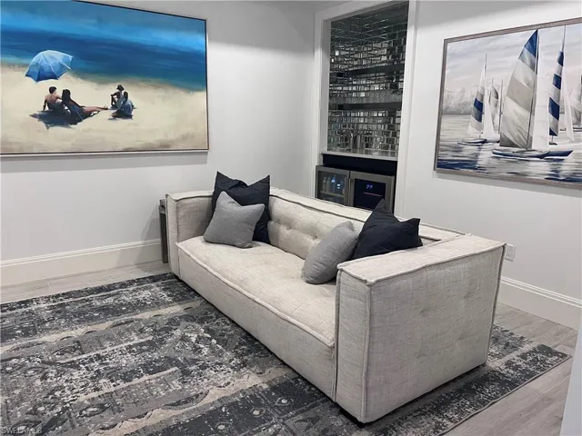 spacious den with built bar and wine frig
