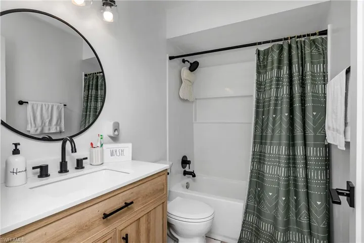 Newly Remodeled Second Bathroom with New Shower/Tub Combo, New Matte Black Shower, Vanity, & Cabinet Door Hardware, New Natural Wood Vanity with White Quartz Counter, Undercounter Square Sink & New Vanity Lighting