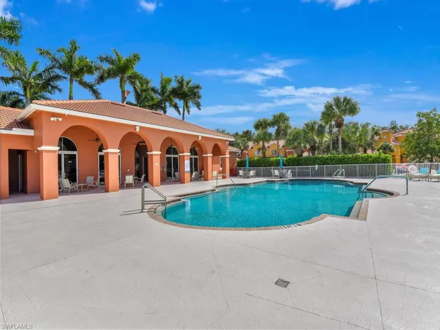 Community pool featuring a patio area