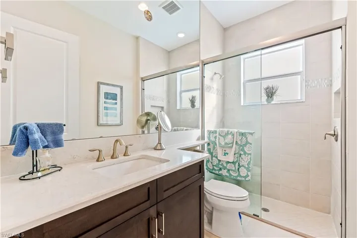 Bathroom#3 feature tile to ceiling, quartzcounters, comfort height toilets