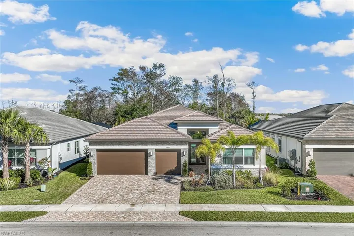 Popular spacious floorplan with 3 en-suitebedrooms plus den and 1/2 bathoom located inthe active adult resort-style community ofValencia Trails in Naples, Florida.