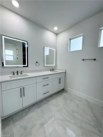Full bath featuring a stall shower and tile patterned flooring