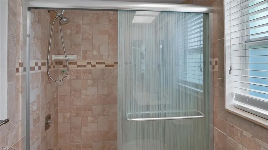 Full bathroom with a stall shower