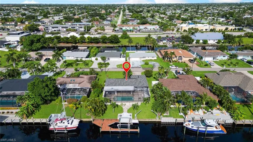Aerial perspective of suburban area with a large body of water