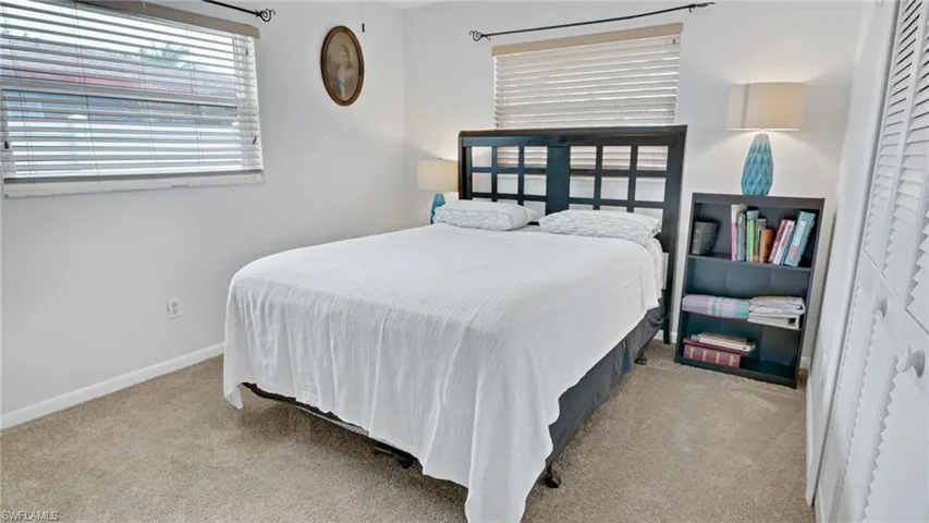 Bedroom with light carpet