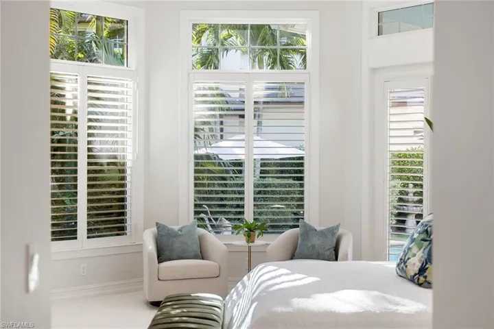 Carpeted bedroom featuring baseboards