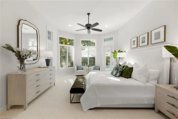 Bedroom with light colored carpet and recessed lighting