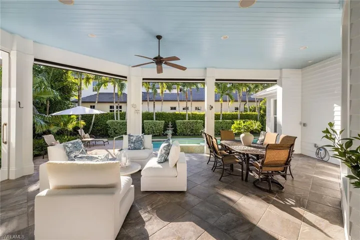Sunroom / solarium featuring healthy amount of natural light and wood ceiling