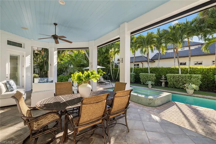Sunroom featuring a hot tub and wooden ceiling