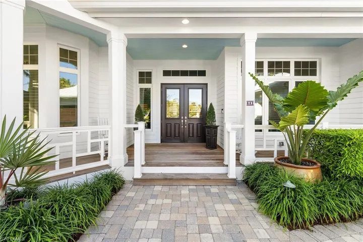 View of exterior entry featuring a porch