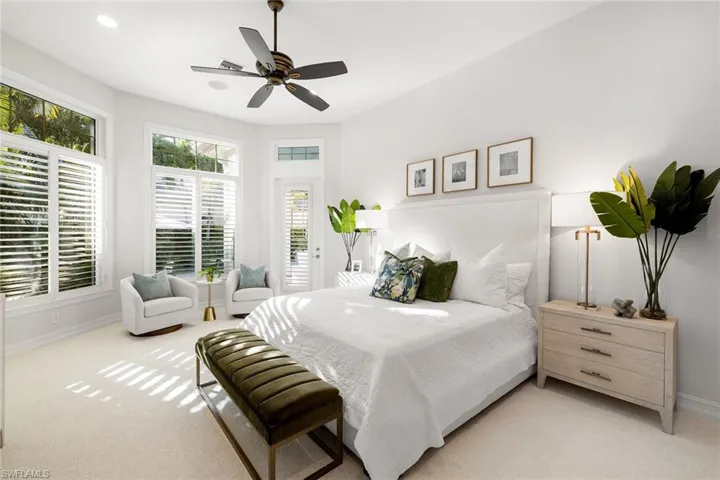 Bedroom with light colored carpet, a ceiling fan, and recessed lighting