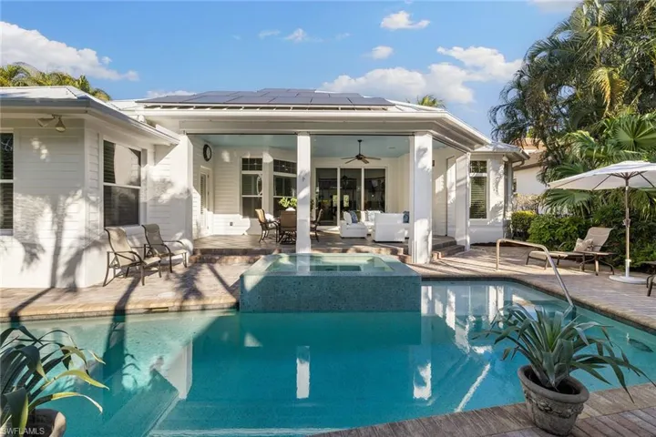 View of swimming pool with a ceiling fan, a patio, an outdoor hangout area, outdoor dining area, and a pool with connected hot tub