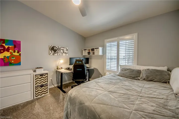 Guest bedroom with plantation shutters