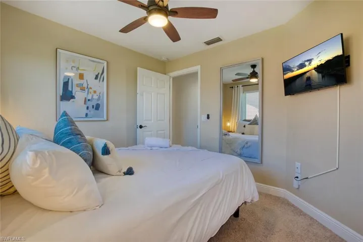 Bedroom with carpet flooring and a ceiling fan