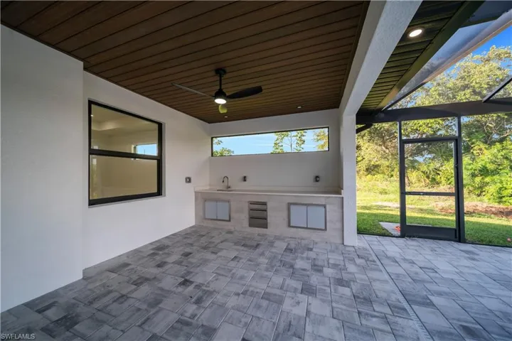 View of patio / terrace featuring an outdoor kitchen and a ceiling fan
