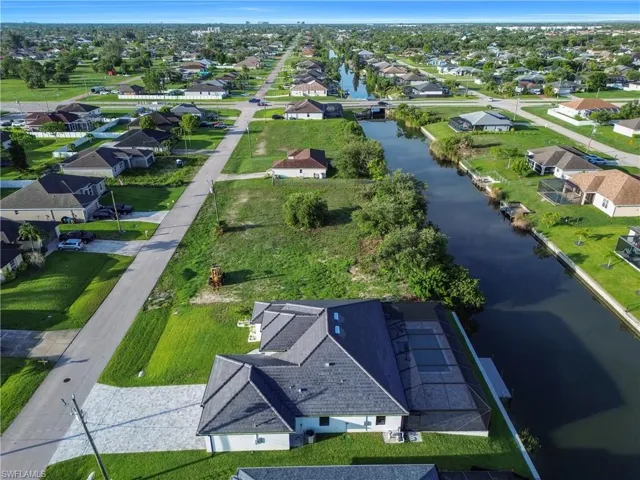 Aerial perspective of suburban area with a large body of water