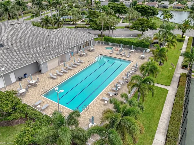 Community pool with a patio
