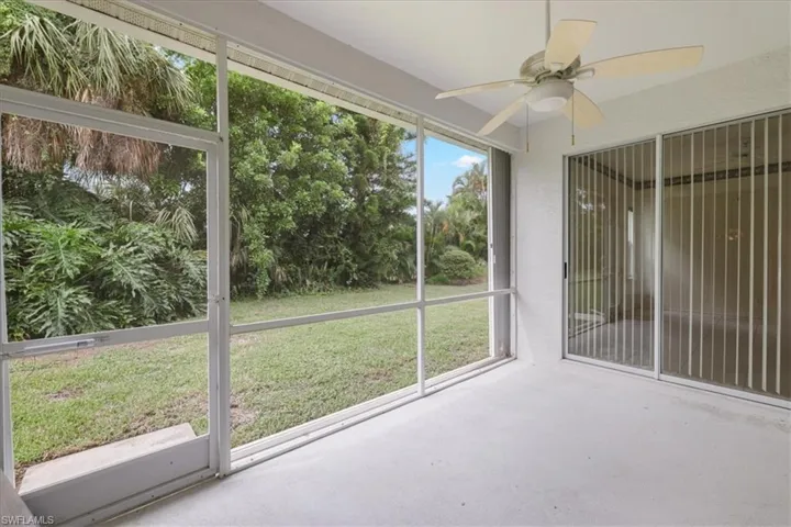 Unfurnished sunroom with a ceiling fan