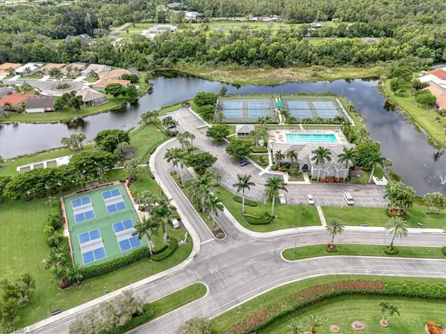 Aerial overview of property's location with a large body of water and a pool area