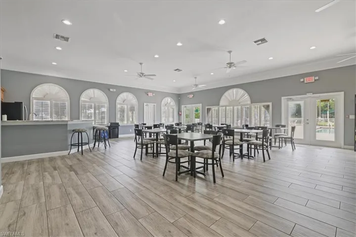 Dining space featuring recessed lighting, wood tiled floors, ornamental molding, and french doors