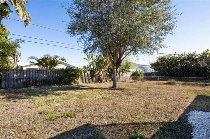 View of fenced backyard