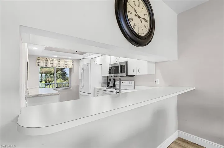 Kitchen has a roomy pass through at bar height. It can accommodate several stools allowing for a quick snack or breakfast spot.