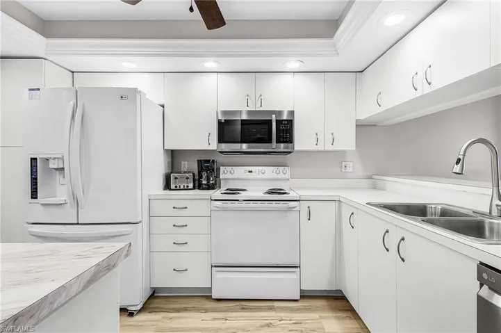Kitchen has perimeter task lighting, dimmable overhead ambient lighting, newer Microwave, Dishwasher and Gooseneck faucet