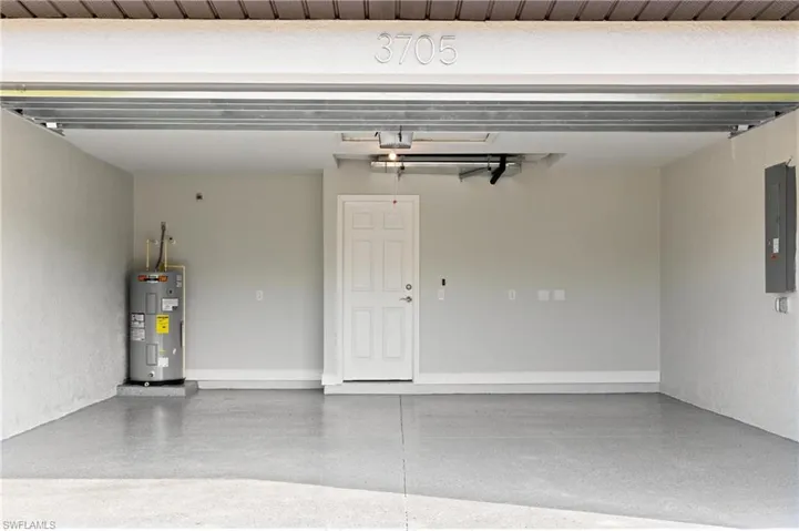 Garage with electric panel and water heater
