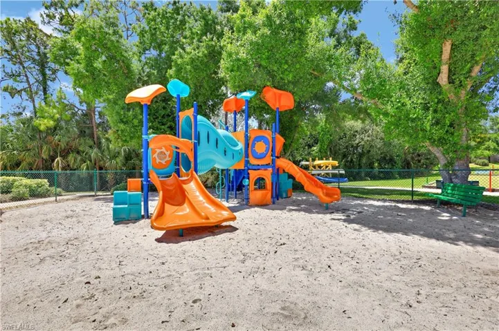 Communal playground featuring fence