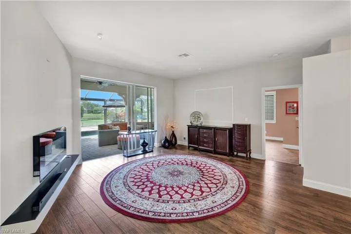 Living area featuring hardwood / wood-style floors and baseboards
