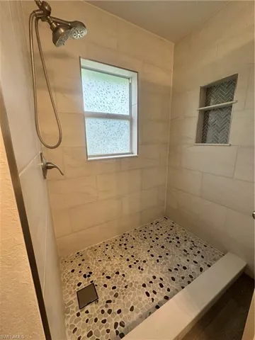 Full bath with a shower stall