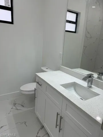 Bathroom featuring toilet and vanity